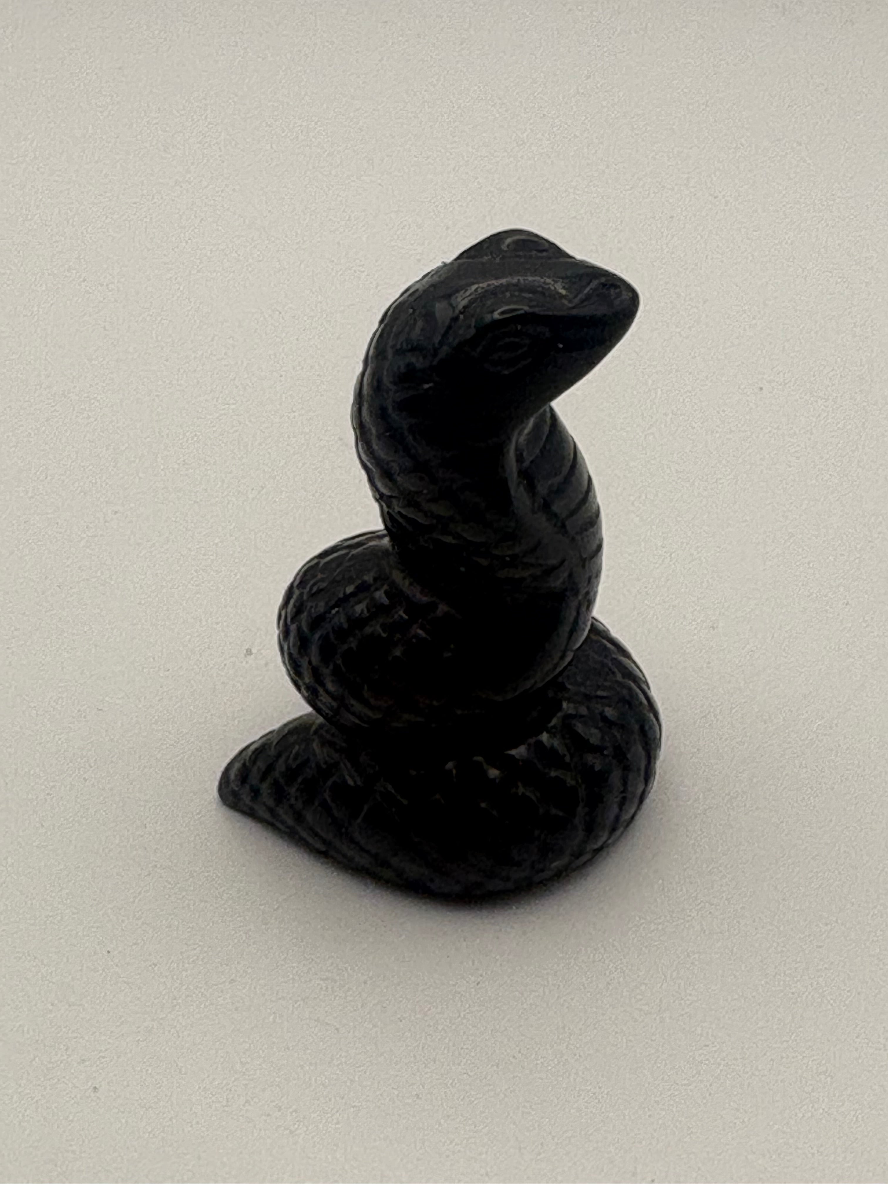 Obsidian Snake Carving